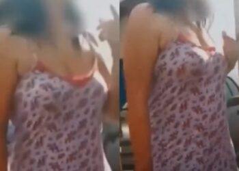 Mulher recebe técnicos de energia usando roupa íntima e portando arma