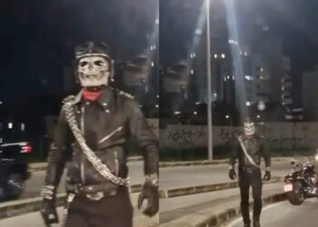 Mulher fica sem gasolina em avenida de BH e é surpreendida por ‘Motoqueiro Fantasma’