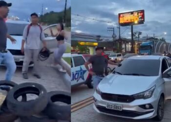 Homem aponta arma para manifestantes durante protesto na Augusto Montenegro, em Belém
